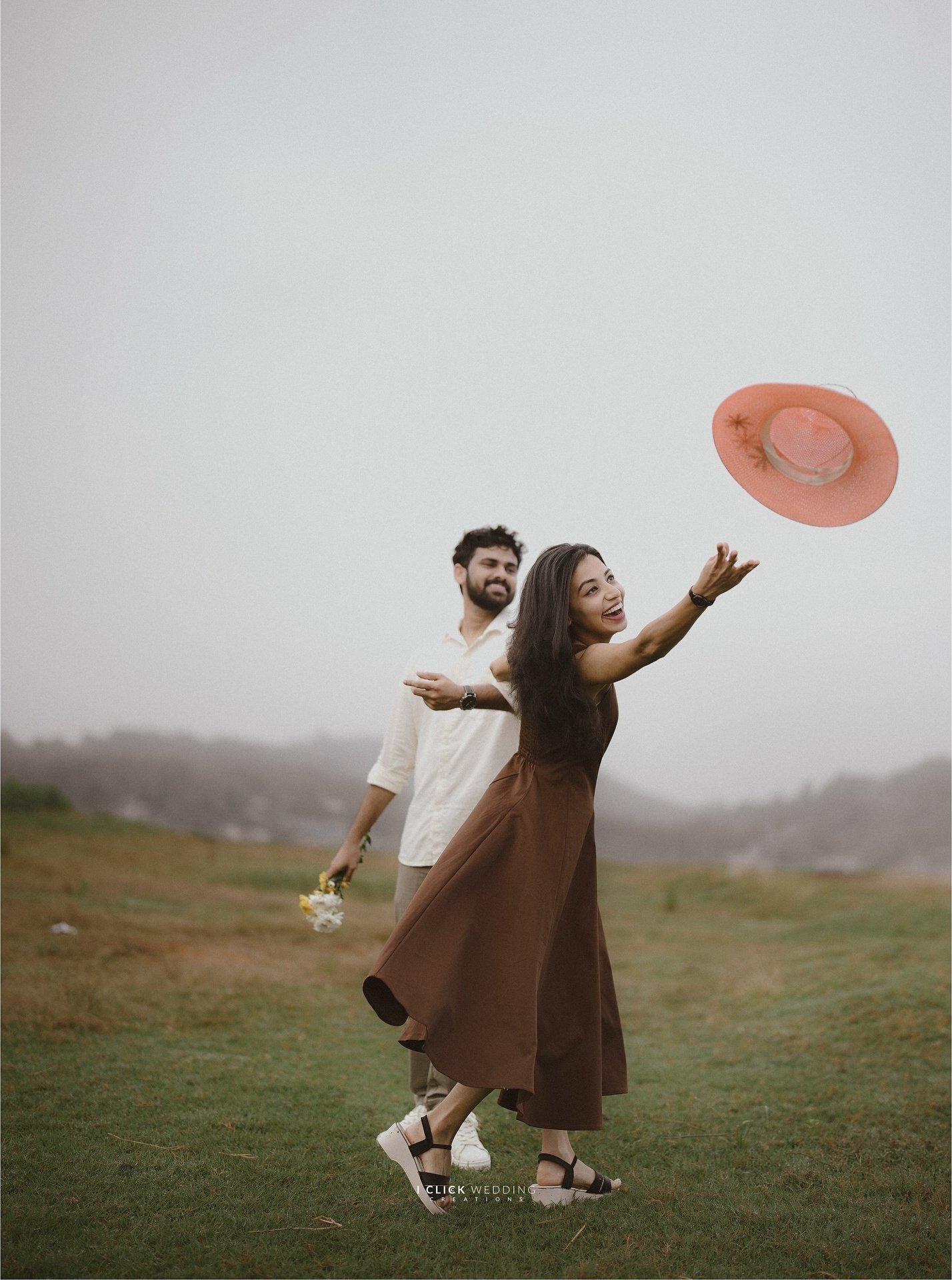 A couple sharing a playful moment outdoors